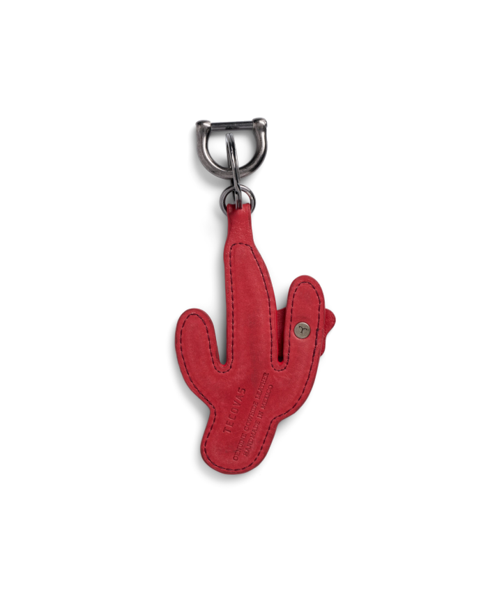A red leather keychain in the shape of a cactus with embossed text and a metal clasp attached at the top.