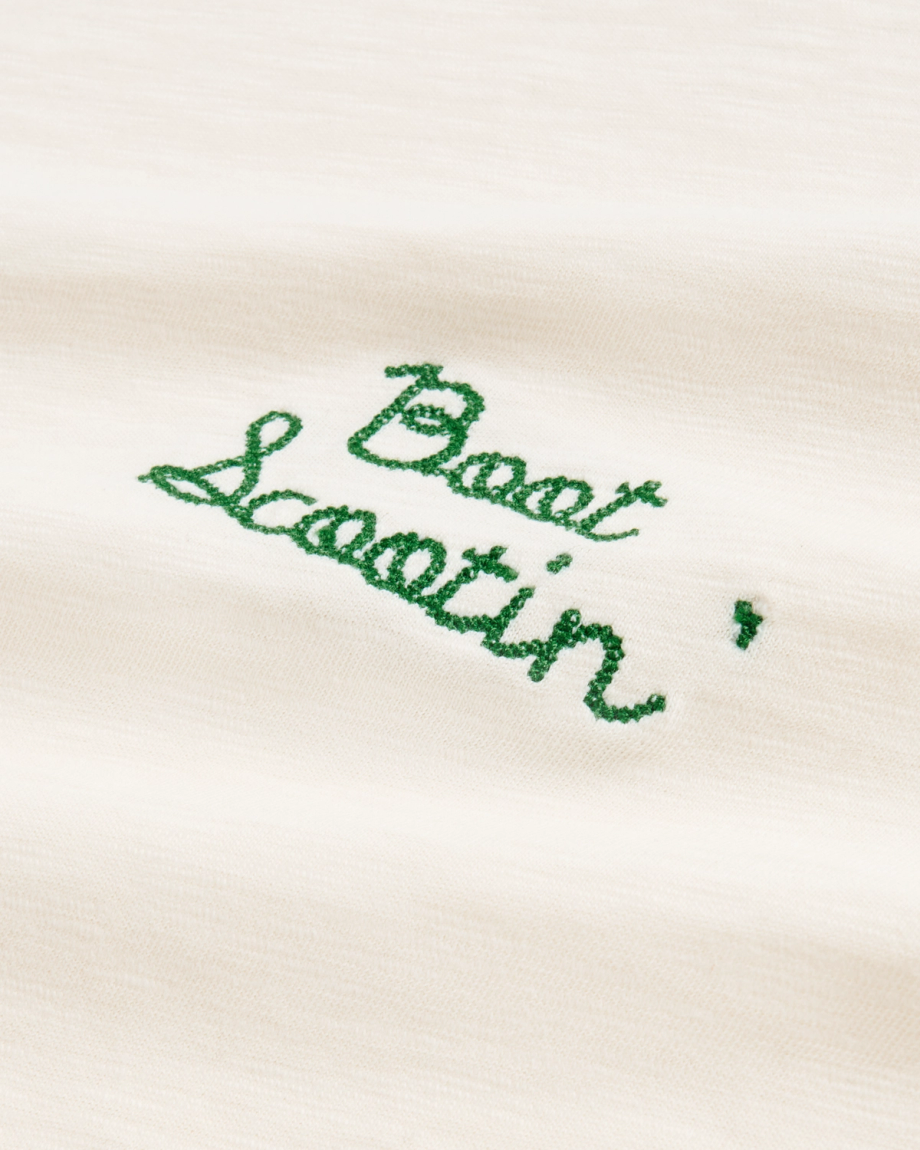 Closeup view of Women's Vintage Ringer Tee - Bone / Green