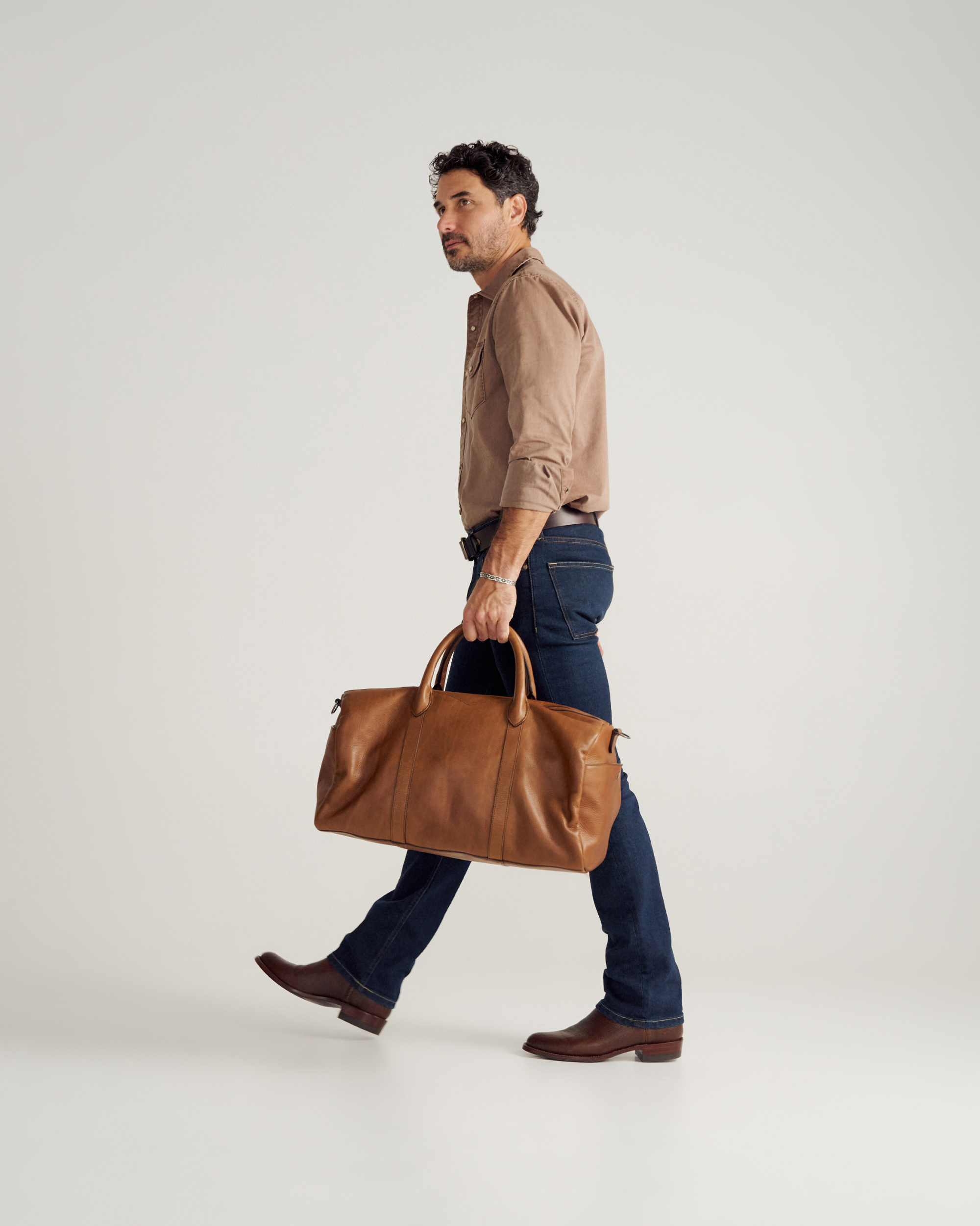 Full view of Lightweight Leather Duffle - Heritage Tan on model