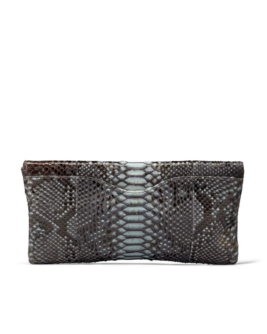 Rectangular clutch bag with a textured snakeskin pattern in shades of grey and blue.