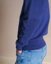 Closeup view of the men's old school sweatshirt in blue on a man in a photo studio