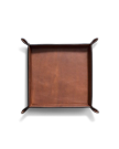 A square brown leather valet tray with raised edges and rounded corners, photographed from above on a white background.