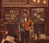 Man with guitar singing in dance hall