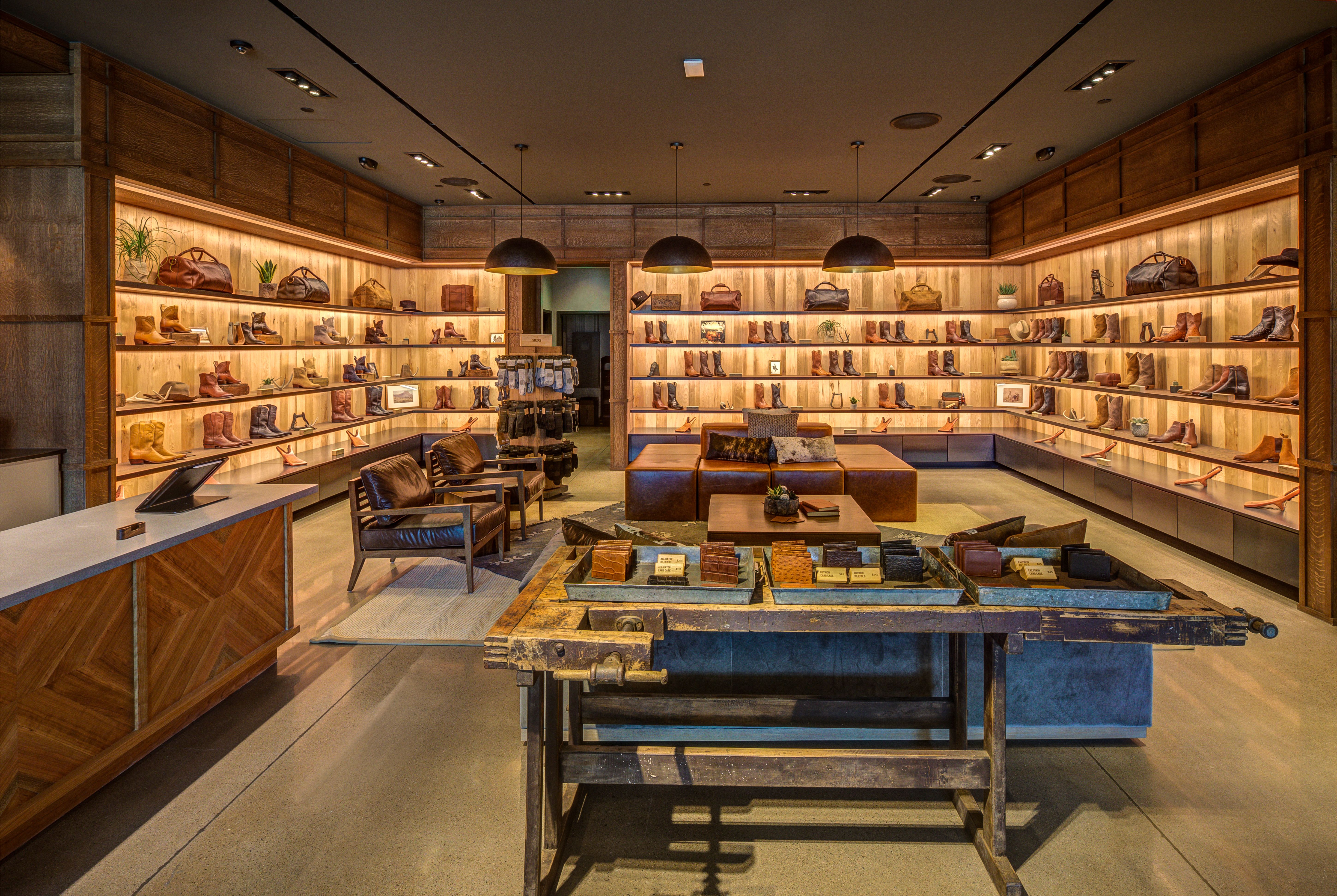 Image of the inside of the Keirland Commons Store showing wall of boots