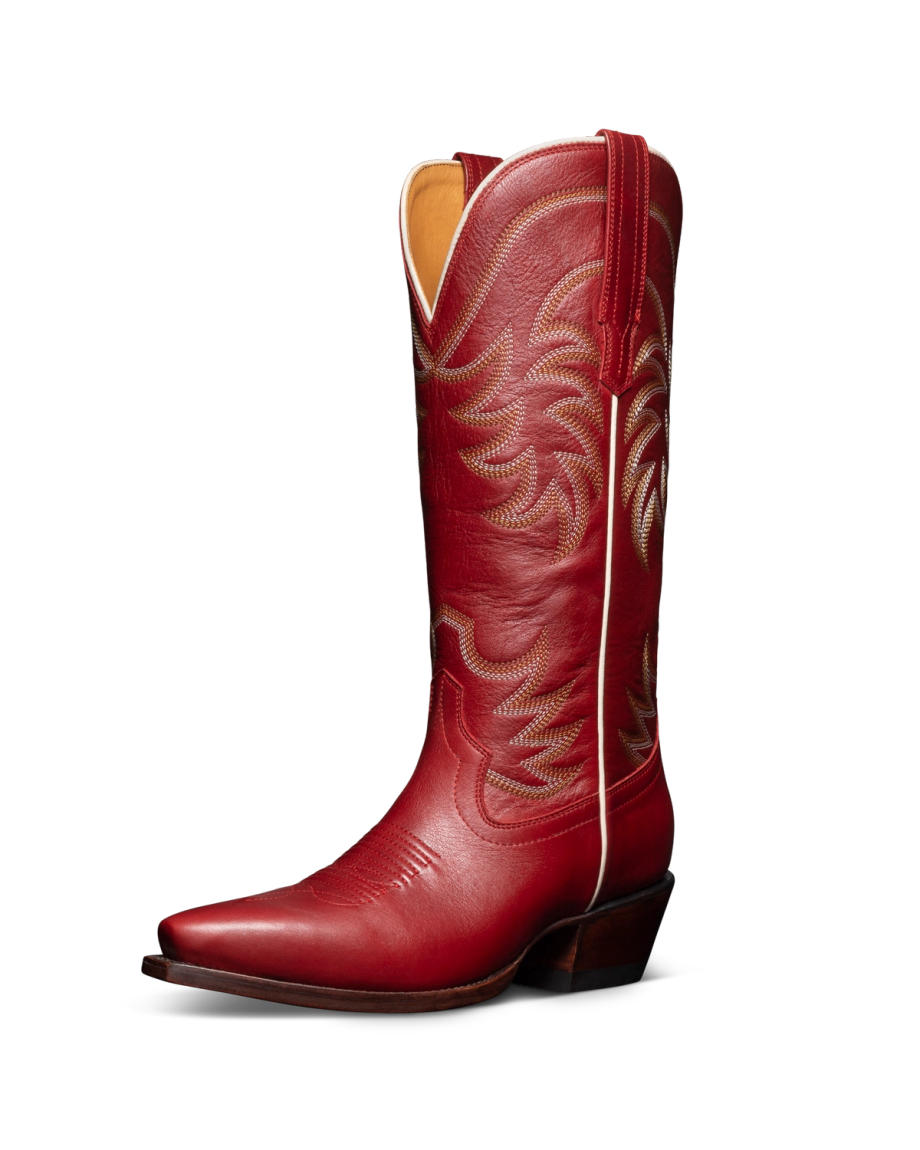 Red cowboy boot with decorative stitching, angled view.
