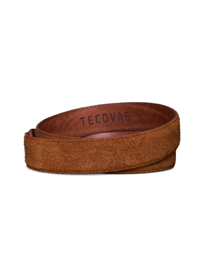 A brown suede belt, coiled with the brand name “TECOVAS” stamped on the inner side.