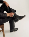 close up of Dean Midnight Black Zip Cowboy Boot on a man's feet 
