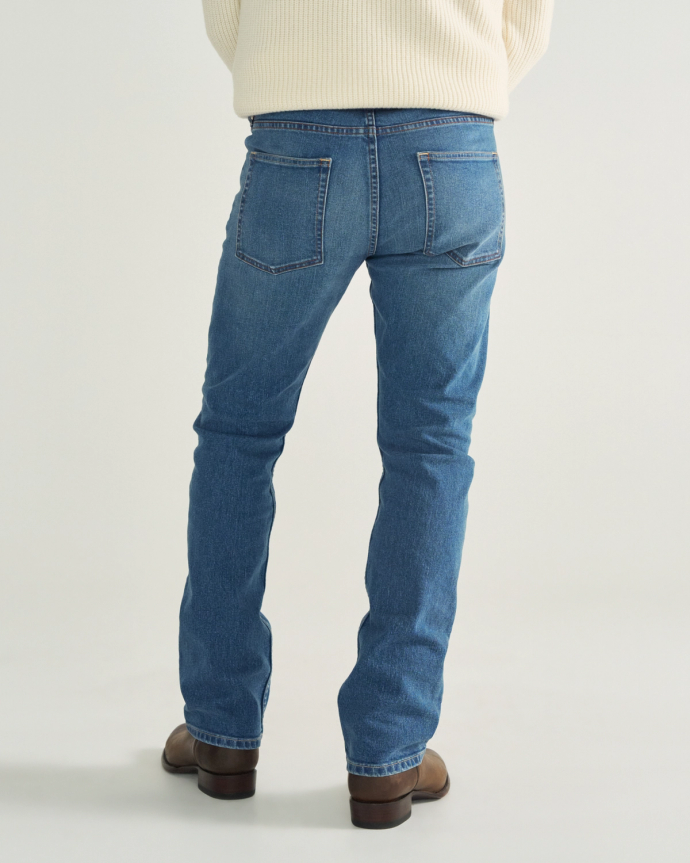 Back view of Men's Slim Straight Stretch Denim - Medium Indigo on model