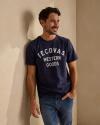 Man wearing a Navy Western Goods Tecovas T Shirt. 