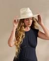 Closeup of woman wearing a straw hat in a photo studio