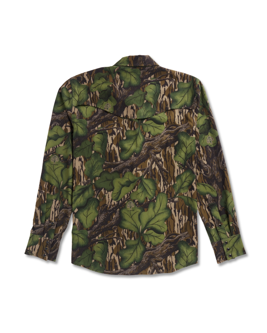 Long-sleeve button-up shirt with a green and brown camouflage pattern resembling leaves and branches, displayed flat with the back facing up.