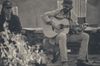 black and white photo of Thomas Rhett playing guitar