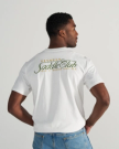 Back view of Men's Saddle Club T-Shirt - Bone/Multi on model