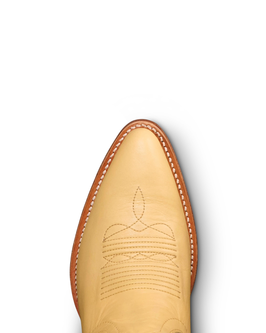 Toe view of The Jolene - Pale Yellow Cowhide on plain background