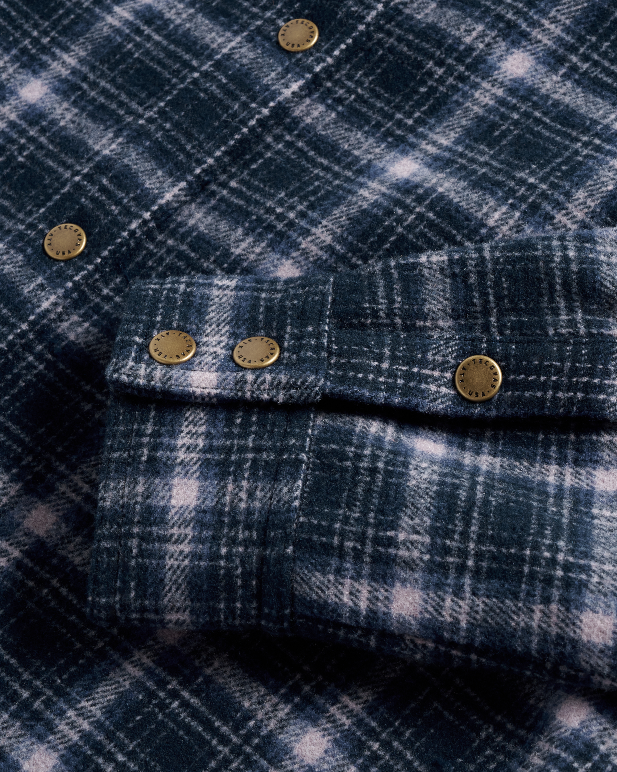 Closeup detail view of Women's Plaid Fringe Shacket - Navy / Mauve