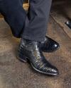 close up picture of Dillon midnight black cowboy boots on a man's feet