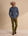 Man wearing Everyday Standard Jeans - Olive on plain background