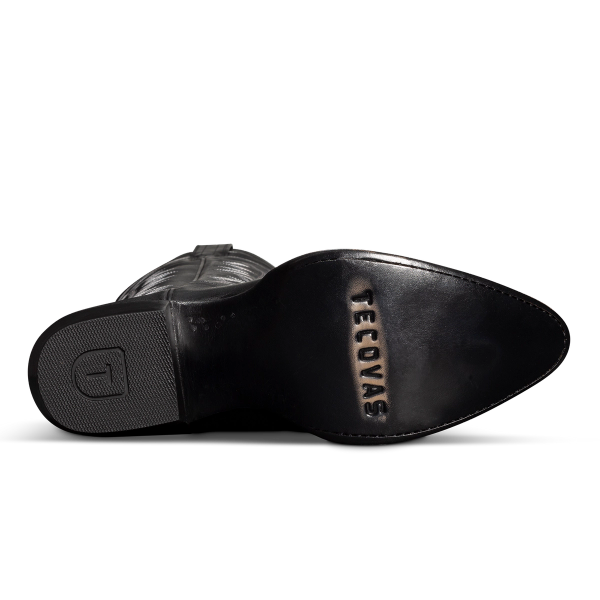 Sole of a black cowboy boot with "TECOVAS" engraved on the heel.