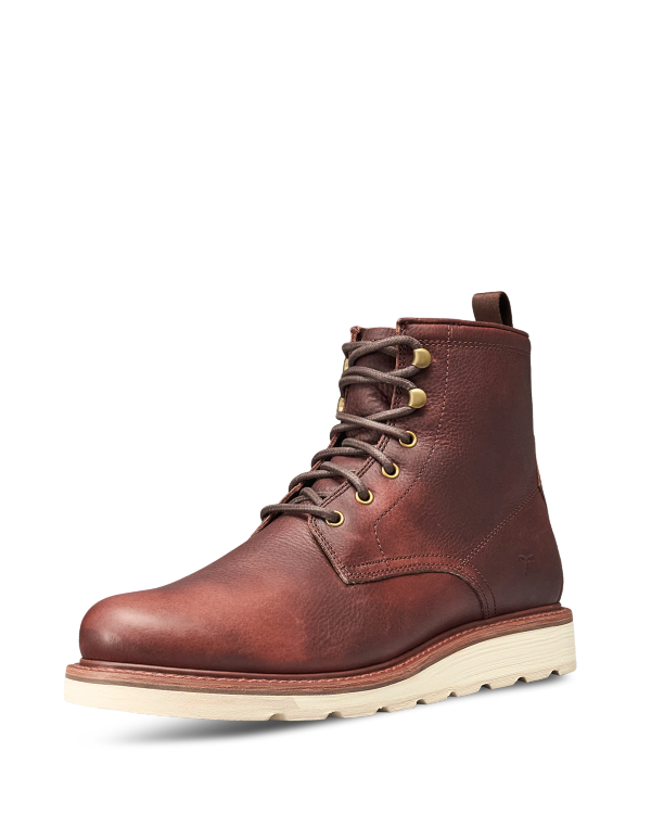 The Knox Lace Up in Cognac Cowhide. Cognac cowhide lace-up boot with a thick white lugged sole.