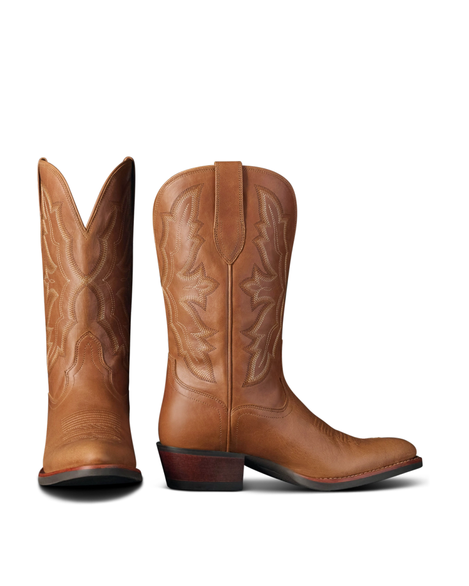 The Britt in Latte Goat. A pair of brown leather cowboy boots from Latte Goat, featuring decorative stitching and angled heels, shown from the side and back.