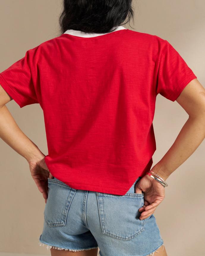 Woman wearing the Howdy Vintage Ringer Tee in Red in a studio