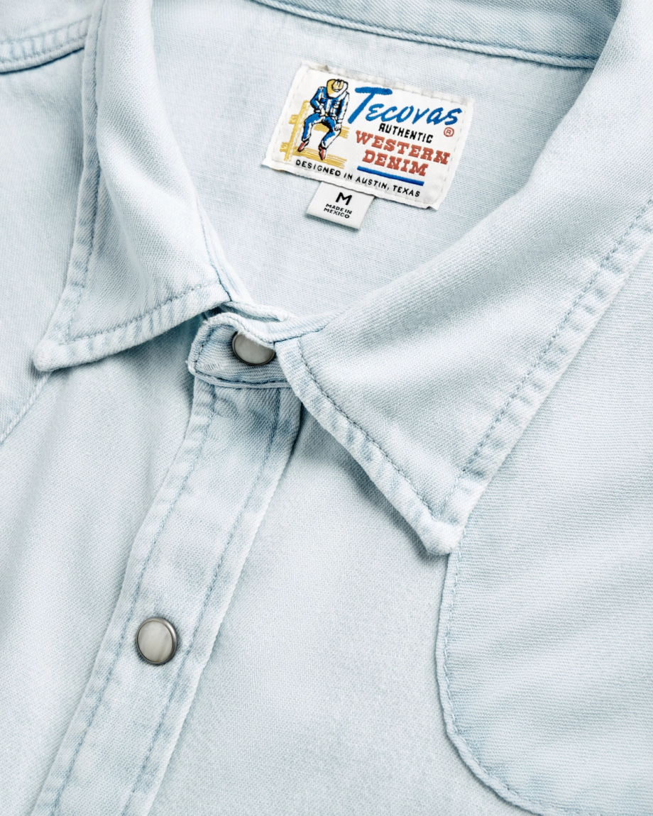 Closeup detail view of Men's Denim Long Sleeve Pearl Snap - Ultra Light