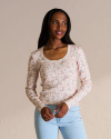 Closeup detail view of Women's Long Sleeve Scoop Neck Pointelle Top - Dusty Pink Ditsy Floral