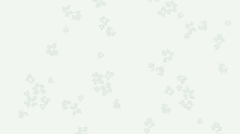 Light gray background with subtle, small floral patterns scattered throughout.