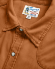 Closeup detail view of Men's Denim Long Sleeve Pearl Snap - Rust