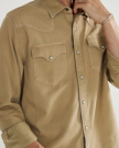 Closeup detail view of Men's Denim Long Sleeve Pearl Snap - Coriander