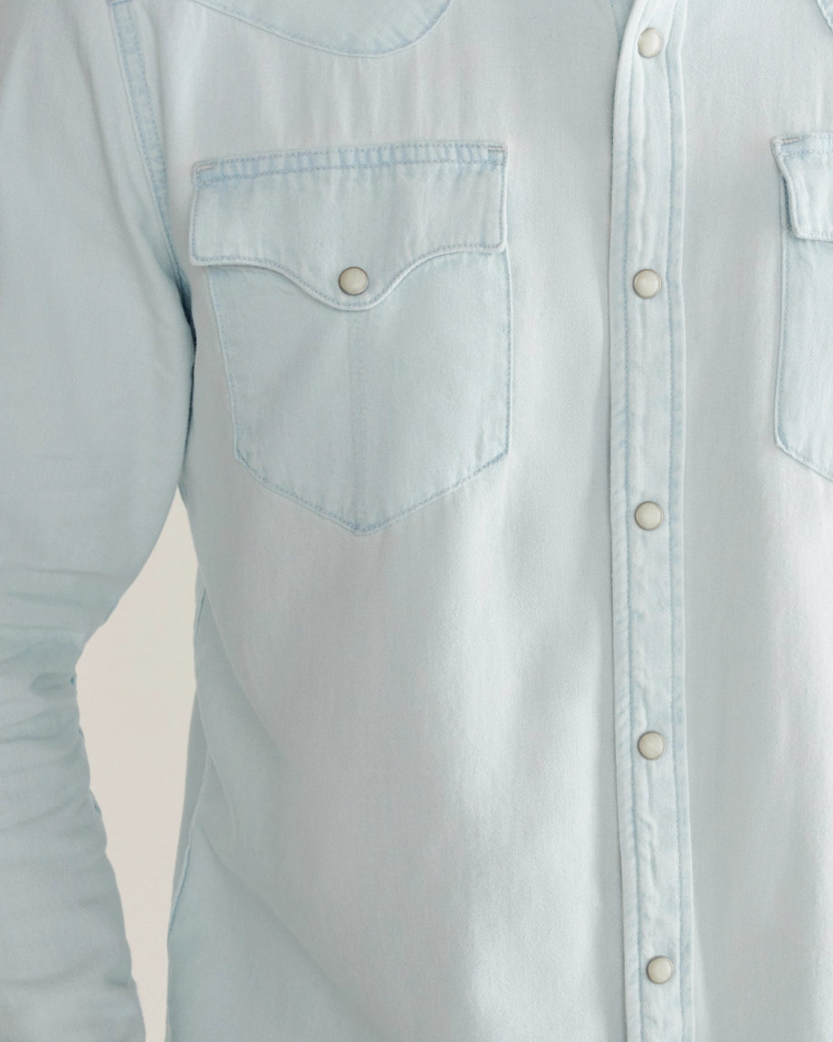 Closeup detail view of Men's Denim Long Sleeve Pearl Snap - Ultra Light