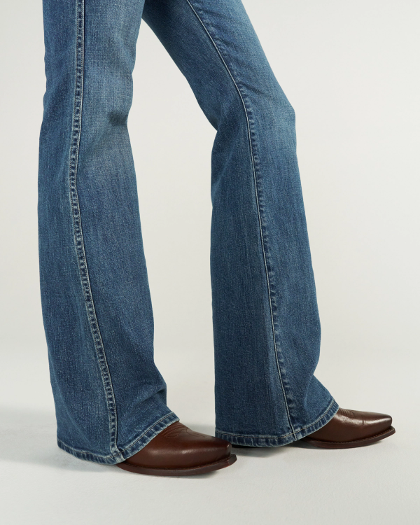 Closeup view of Women's Mid-Rise Slim Flare - Medium Wash