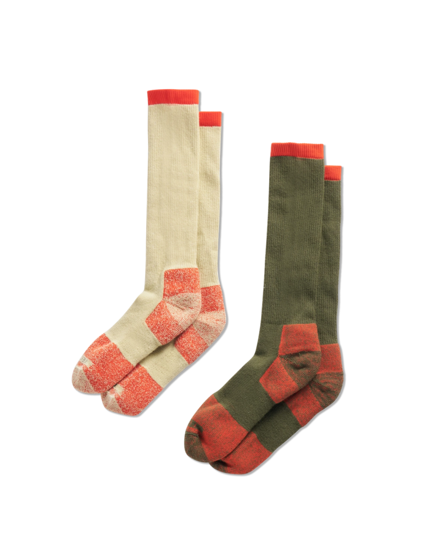 Two pairs of knee-high socks with red accents; one pair is cream with red details, and the other is olive green with red details, both displayed side by side on a black background.