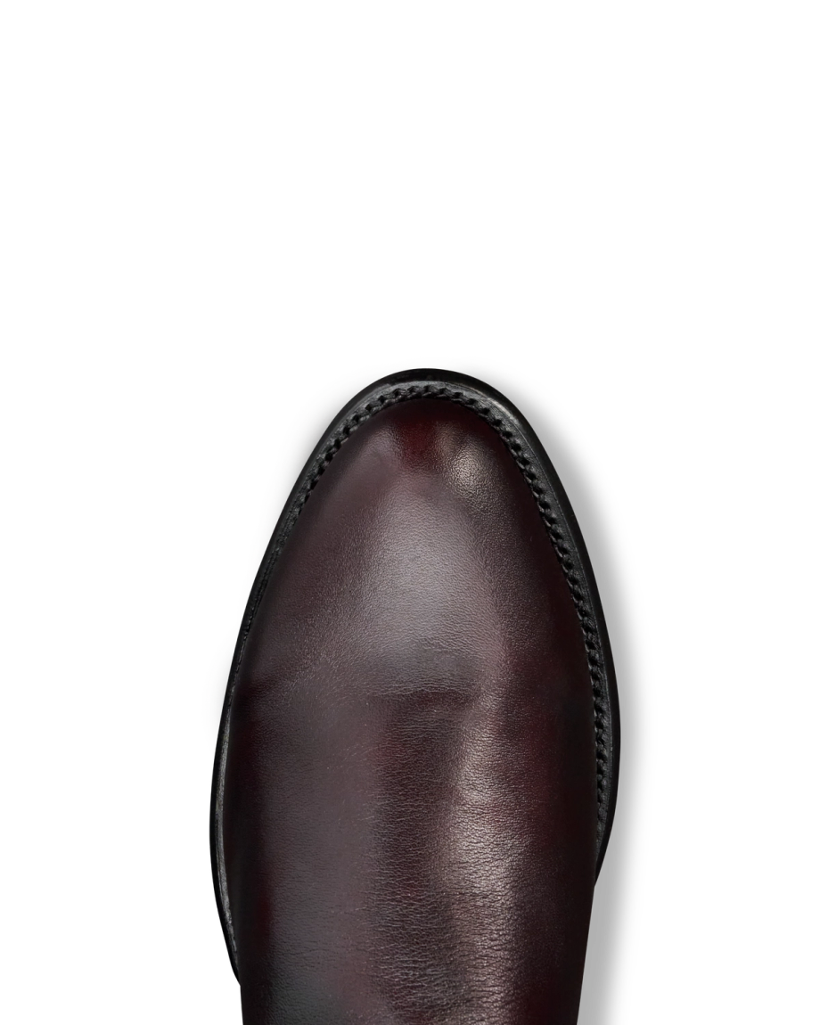 Toe view of The Earl - Black Cherry Cowhide on plain background