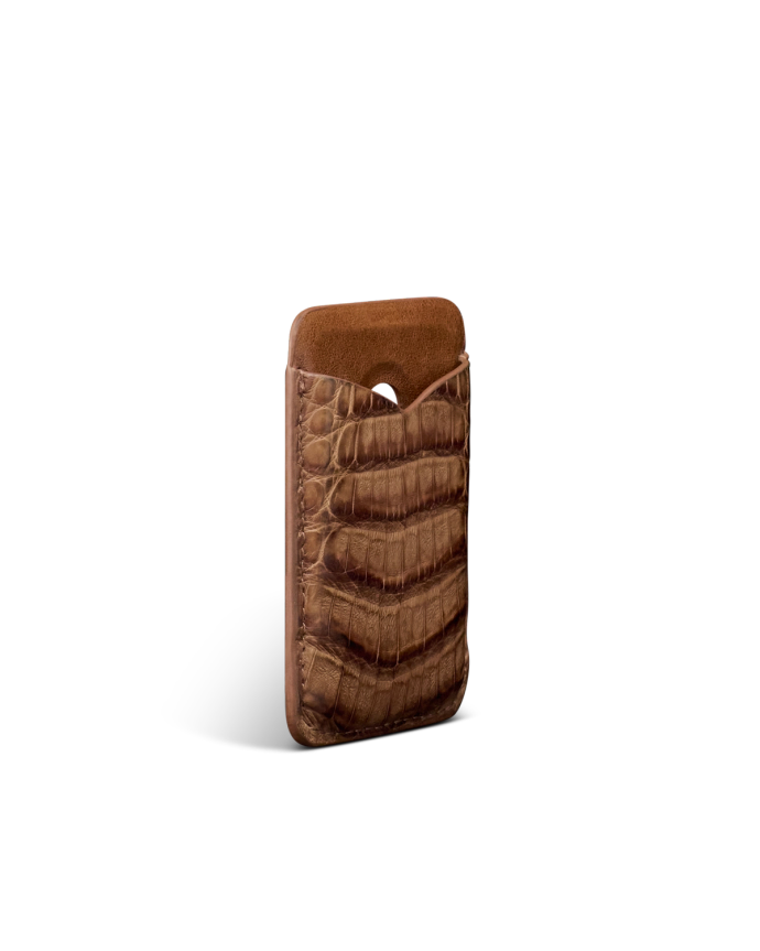 A brown crocodile-patterned leather phone sleeve stands upright against a plain white background.