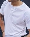 Closeup of man wearing the henley in white