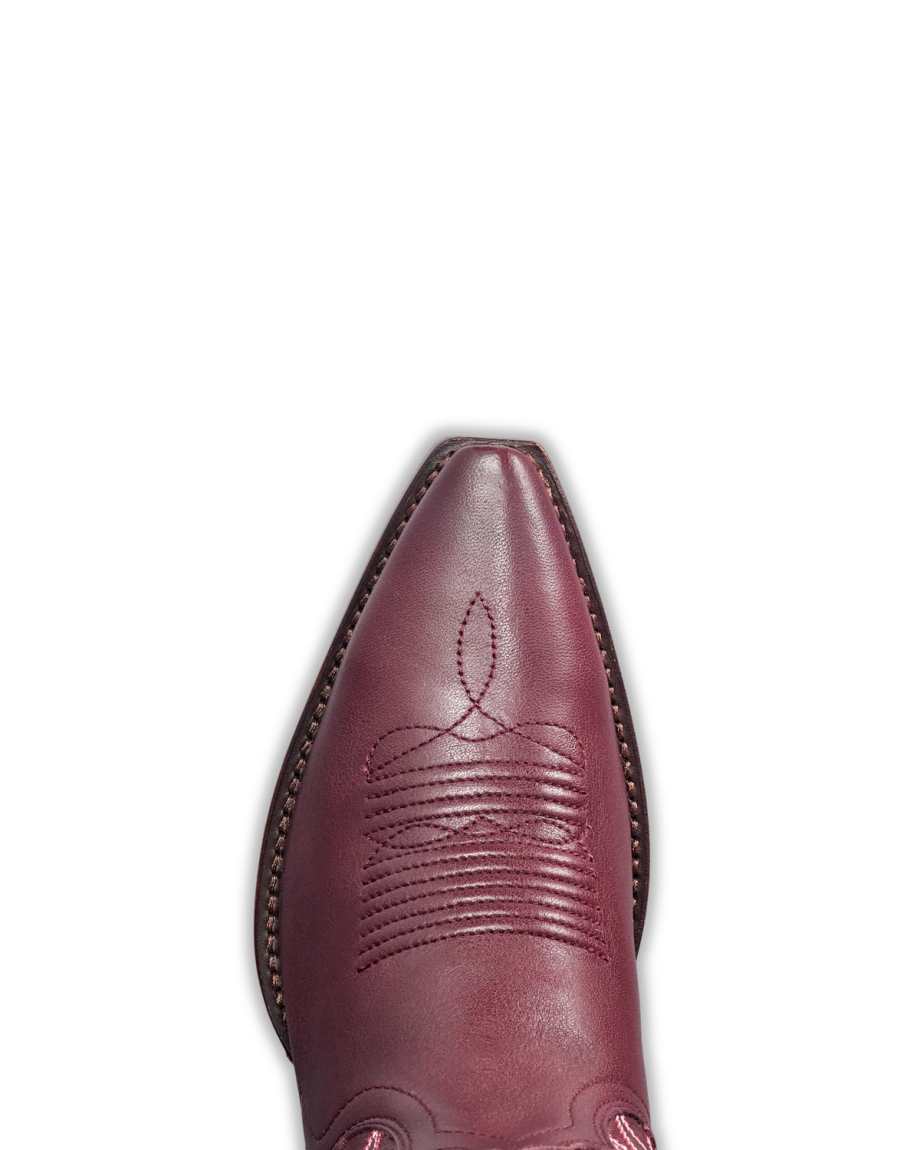 Toe view of The Lynn - Wine Cowhide on plain background