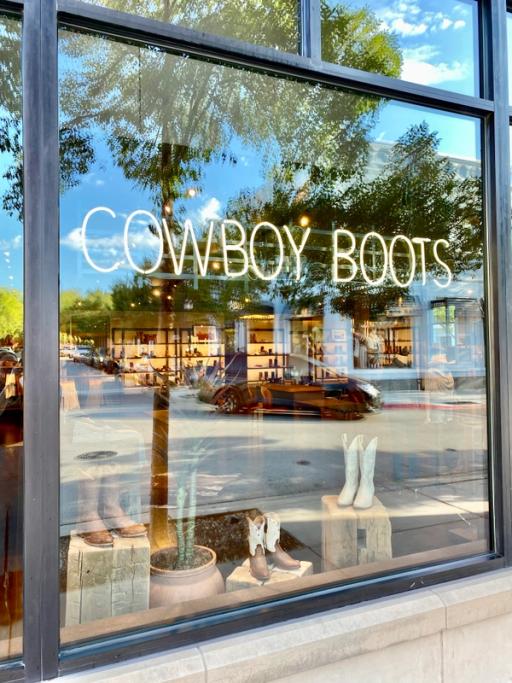 'Cowboy Boots' neon sign at the Tecovas store in Southlake Town Square