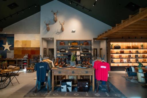 Image of the inside of the Rice Village Store showing the main display of clothes