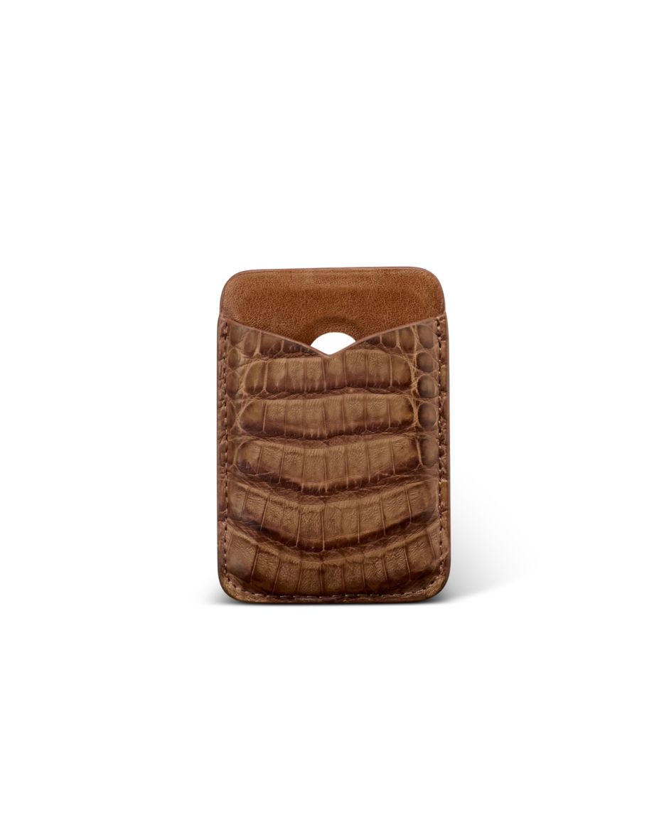 Brown leather card holder with a crocodile pattern, featuring a single pocket and a curved cutout at the top, displayed on a plain white background.