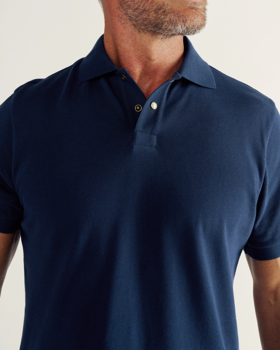 Closeup detail view of Men's Polo Pearl Snap SS - Navy