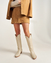 Front view of Women's Mini Suede Skirt - Tan on model