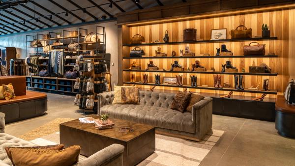 Photo of Tecovas Store boot wall and couches