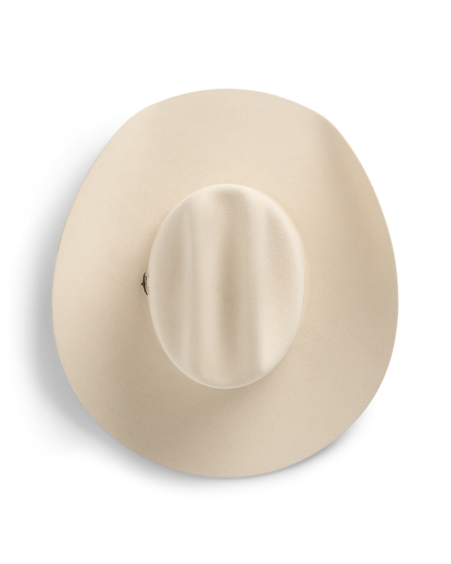 Beige wide-brimmed felt hat photographed from above against a white background.