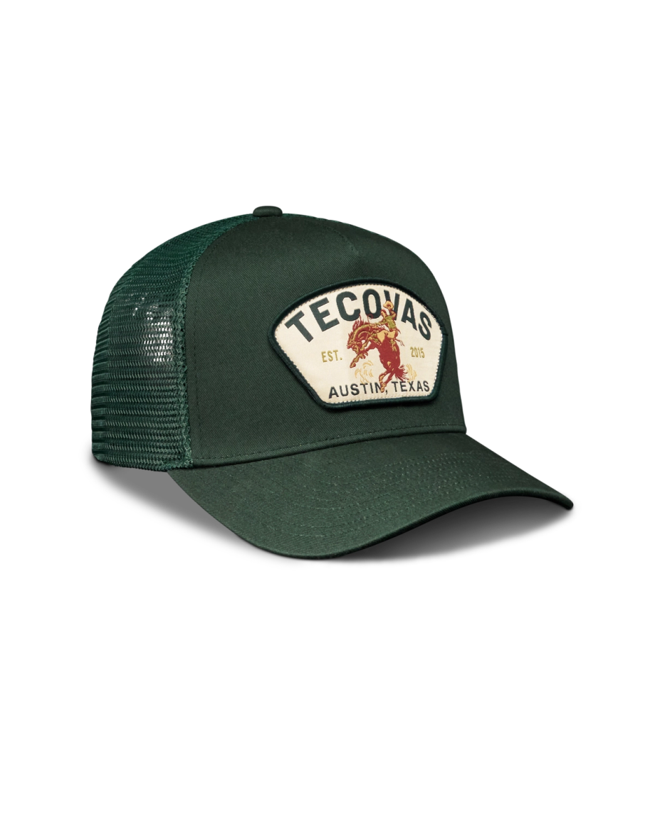 Quarterfront view of Tecovas Buckin Bronc 5 Panel High Pro Trucker - Forest Green on plain background