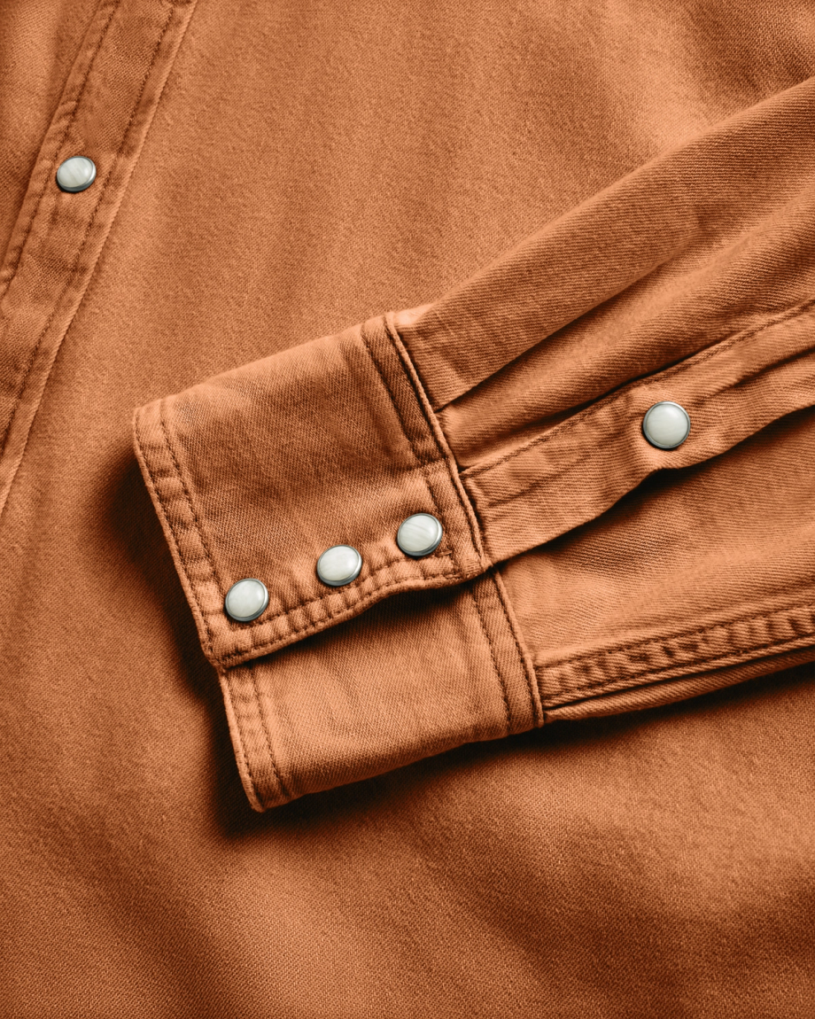Closeup detail view of Men's Denim Long Sleeve Pearl Snap - Rust