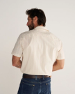 Closeup detail view of Men's Vintage Weight Short Sleeve Pearl Snap - Light Sand/Multi
