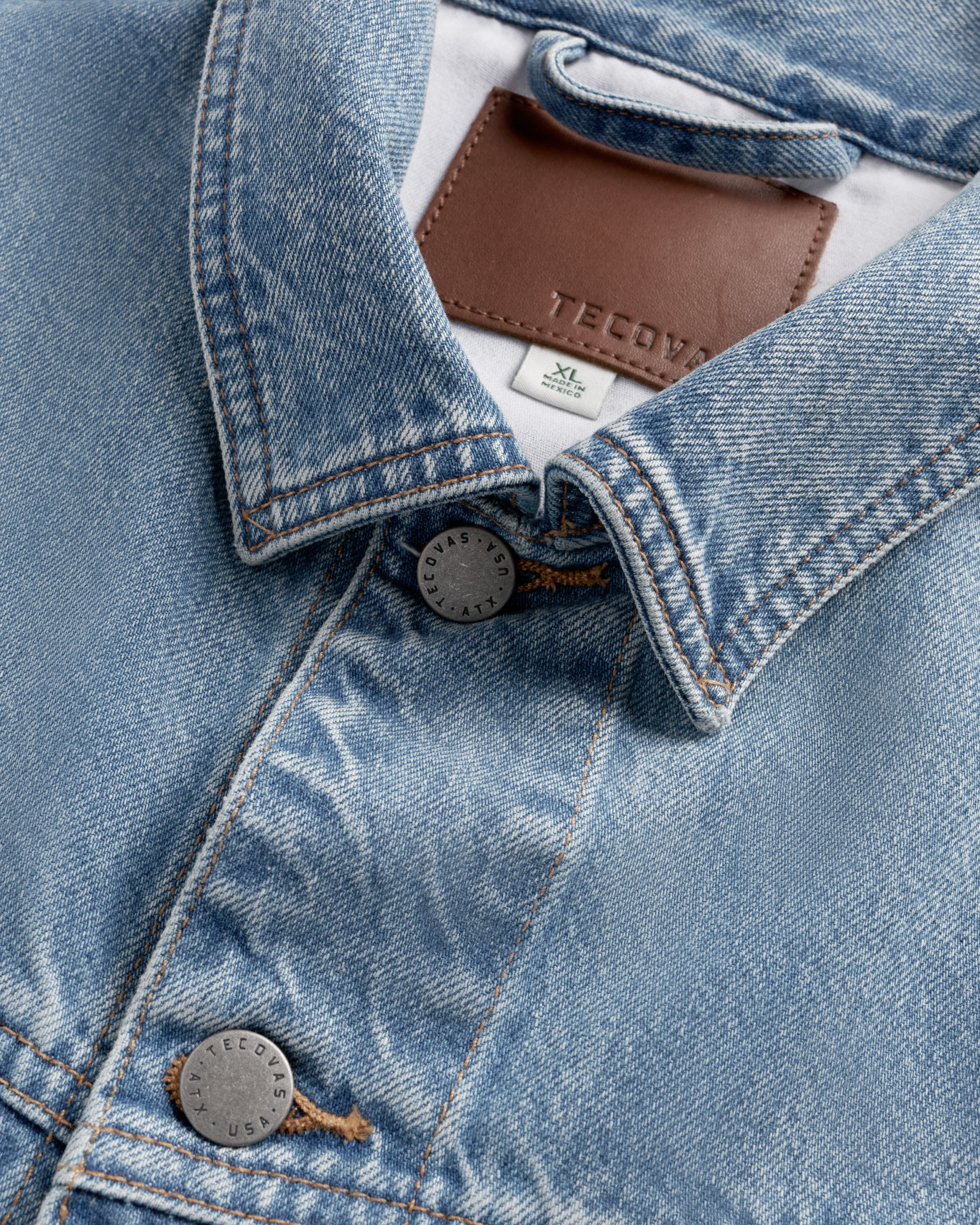 Closeup detail view of Men's Classic Denim Trucker Jacket - Acid Wash