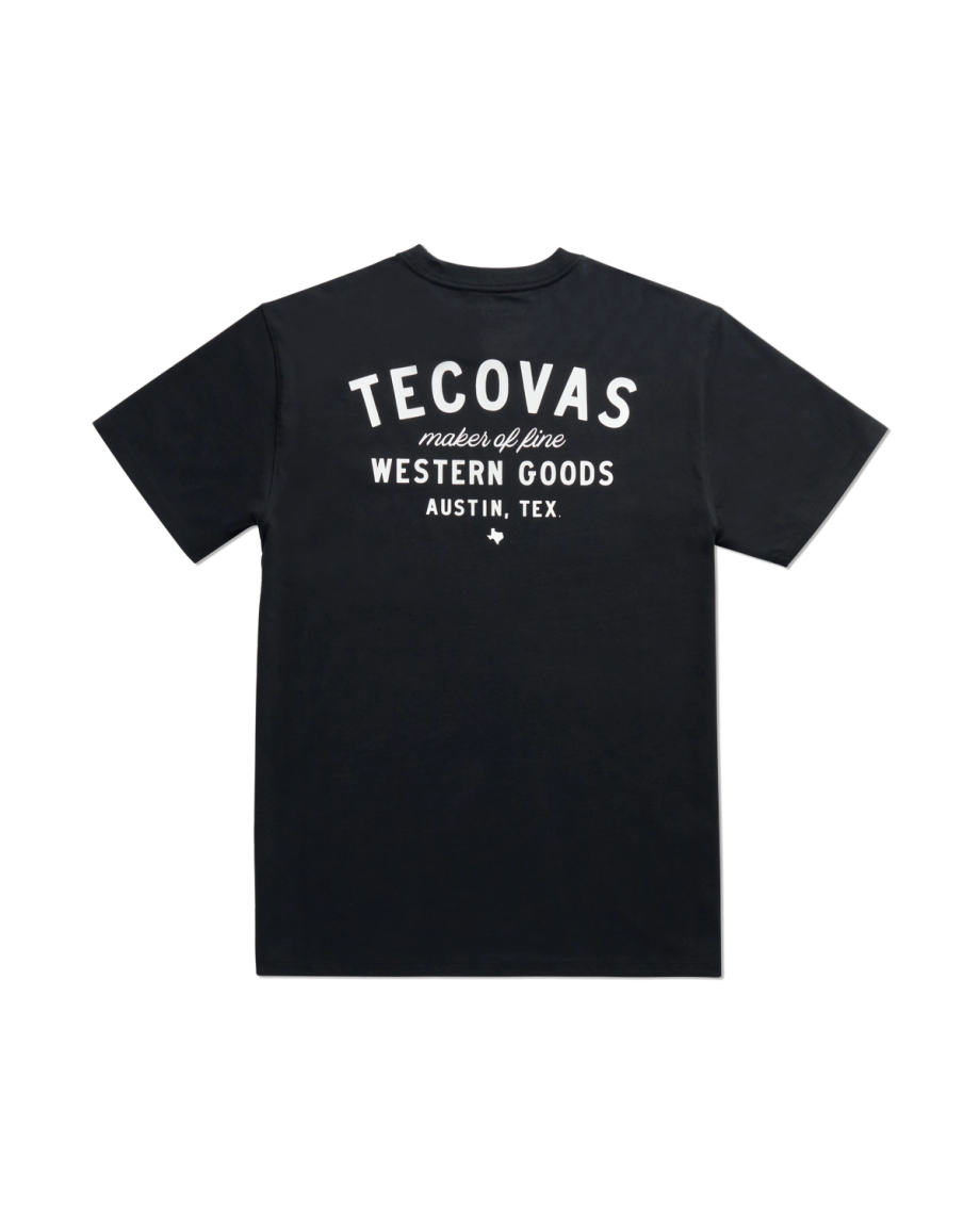 Black short-sleeve t-shirt featuring white text that reads "Tecovas maker of fine Western Goods Austin, Tex." on the back.