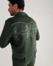 Back view of Men's Tecovas X H Bar C Birthday X Bolero Jacket - Green on model